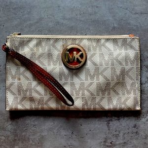 Michael Kors wristlet w gold emblem, Reversible Belt shown in pic sold separate